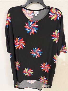LuLaRoe Black Tunic Tee with Colorful Starburst print